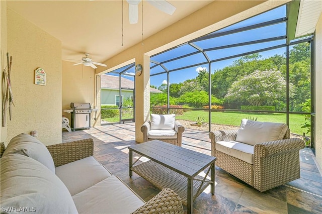 view of patio / terrace featuring ceiling fan, grilling area, outdoor lounge area, and a lanai