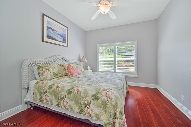 bedroom with ceiling fan and dark hardwood / wood-style floors