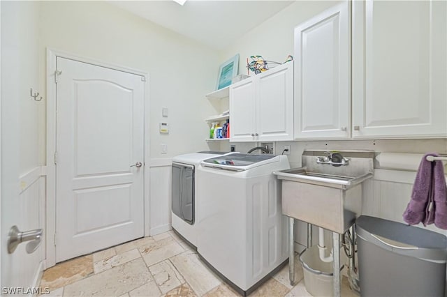 laundry room with cabinets and independent washer and dryer