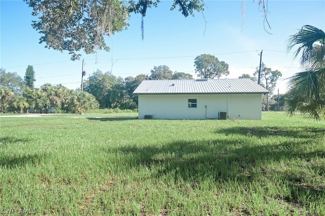 view of yard with central air condition unit