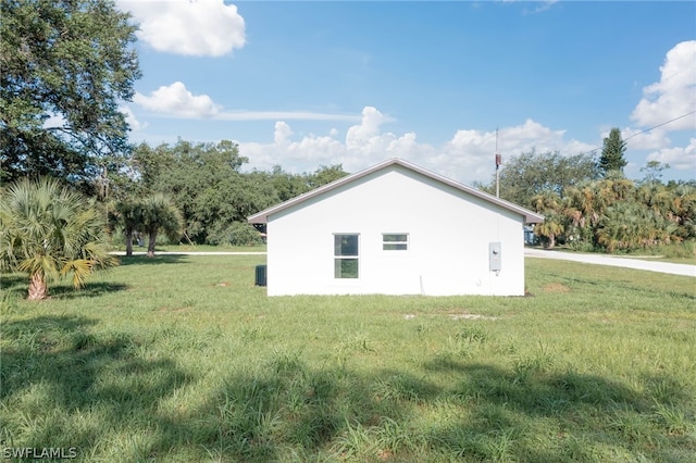 view of home's exterior with a lawn