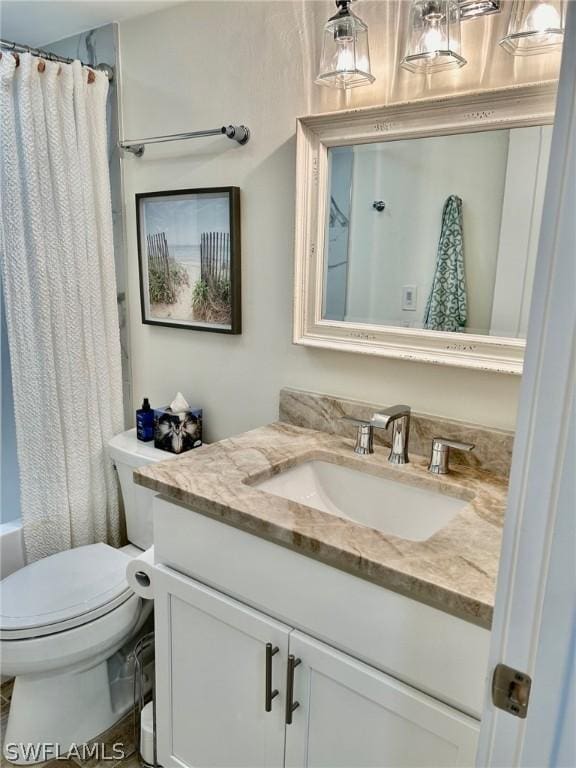 full bathroom with vanity, shower / bathtub combination with curtain, and toilet