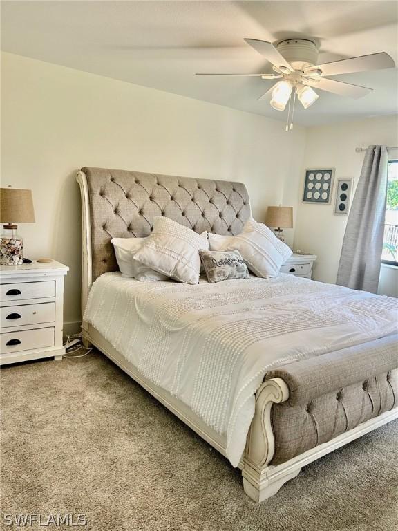 carpeted bedroom with ceiling fan