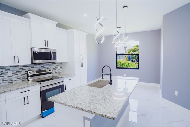 kitchen with sink, range with electric stovetop, a center island with sink, and light tile patterned flooring