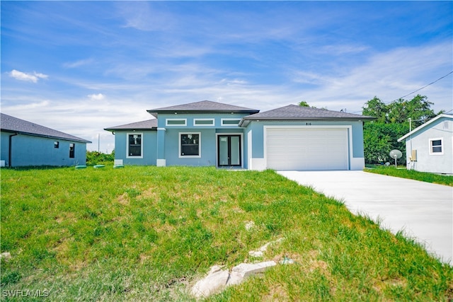 view of front of house featuring a garage and a front yard