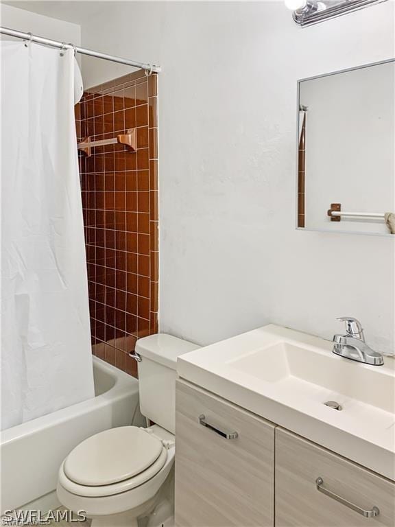 full bathroom featuring toilet, vanity, and shower / bath combo