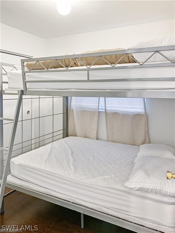 bedroom featuring hardwood / wood-style flooring