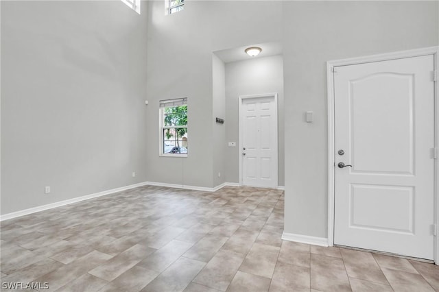 entryway with a towering ceiling