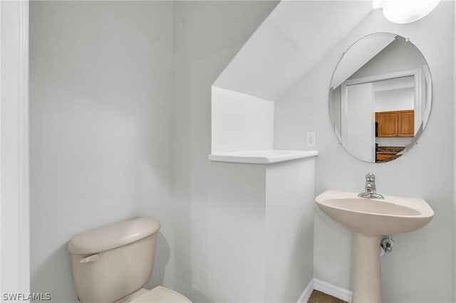 bathroom featuring sink and toilet