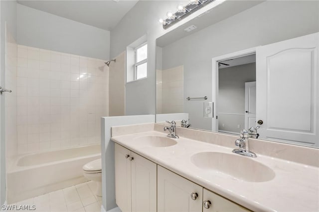 full bathroom featuring shower / bathtub combination, tile patterned floors, toilet, and vanity