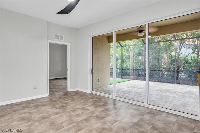 spare room with ceiling fan