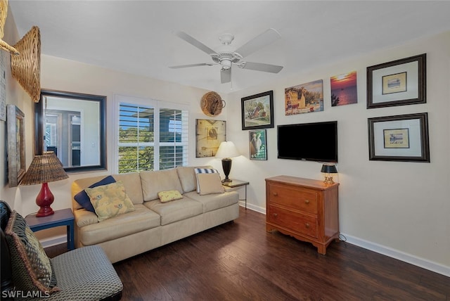 living room featuring dark hardwood / wood-style flooring and ceiling fan