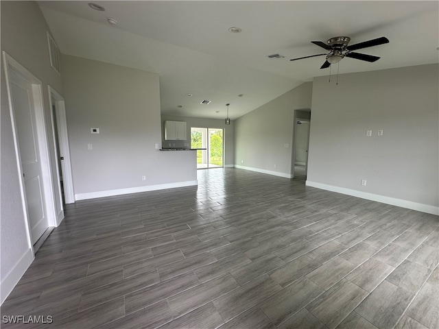 unfurnished living room with ceiling fan, hardwood / wood-style floors, and vaulted ceiling