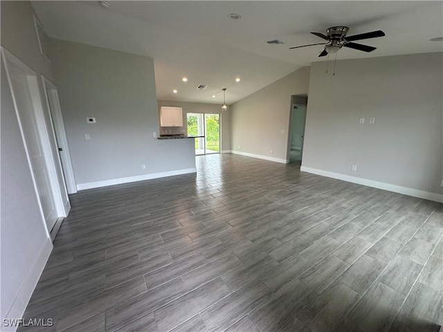 unfurnished living room with baseboards, visible vents, lofted ceiling, ceiling fan, and dark wood-type flooring