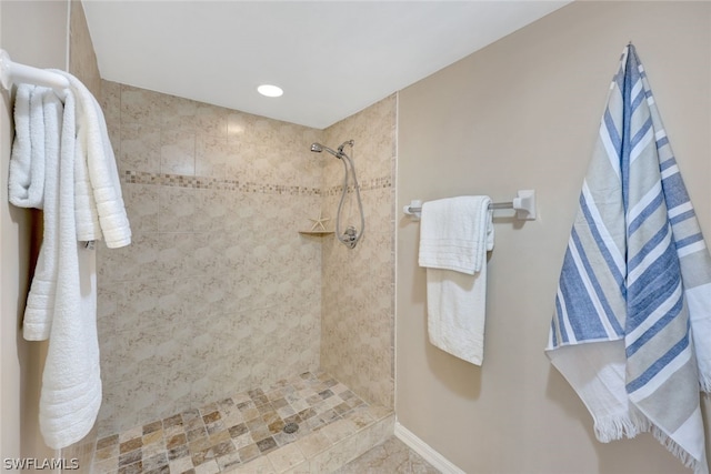 bathroom featuring tiled shower