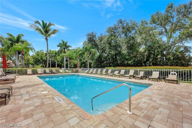 view of swimming pool featuring a patio area