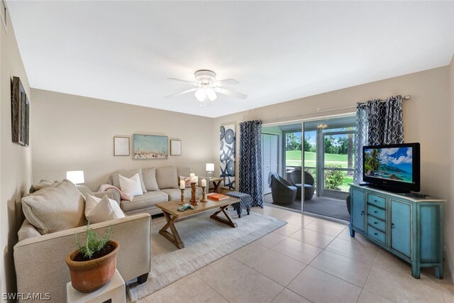 tiled living room with ceiling fan