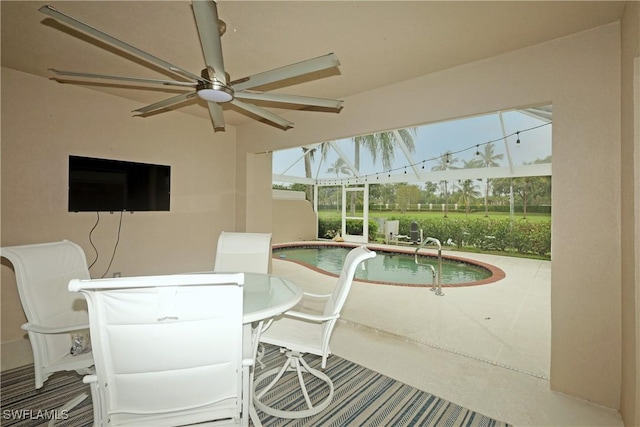 interior space with ceiling fan and a pool