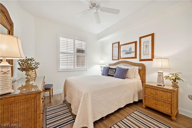 bedroom featuring dark hardwood / wood-style floors and ceiling fan