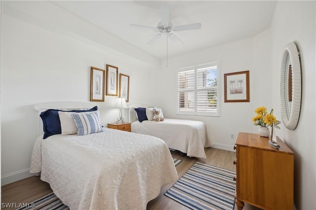 bedroom with hardwood / wood-style flooring and ceiling fan