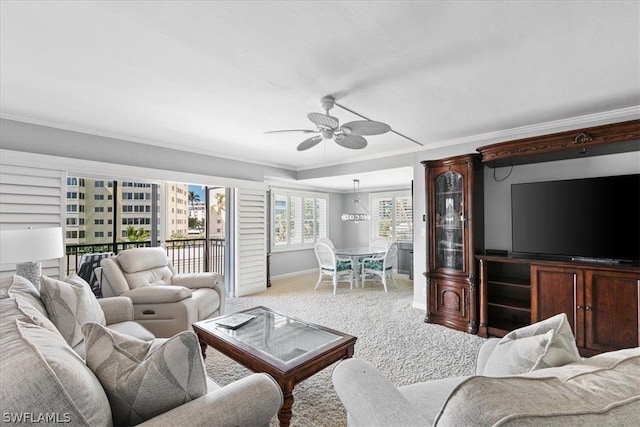 living room featuring carpet flooring, crown molding, and ceiling fan