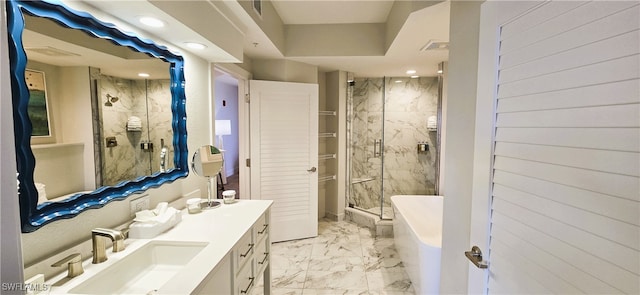 bathroom featuring vanity and independent shower and bath