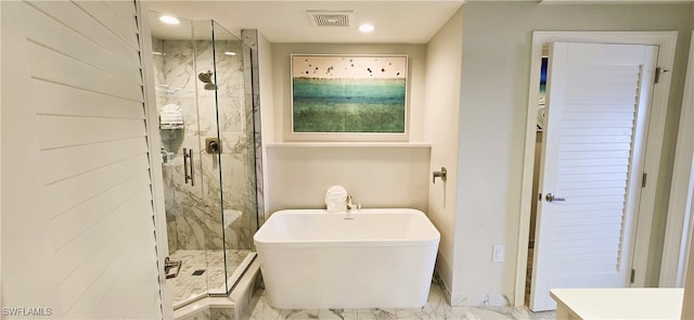 bathroom featuring separate shower and tub