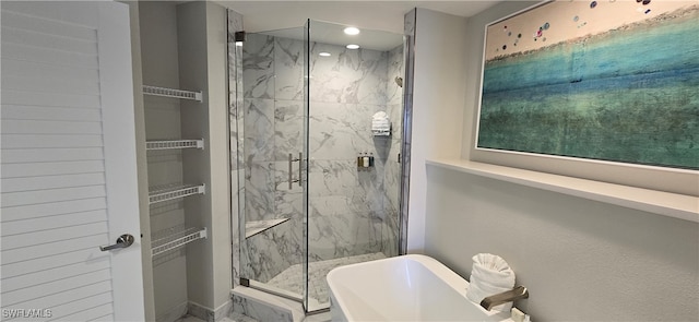 bathroom featuring separate shower and tub