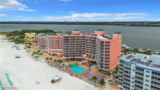 birds eye view of property with a water view