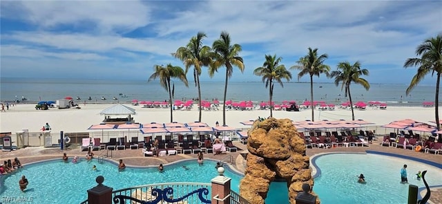 view of swimming pool featuring a water view