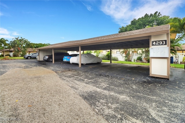 view of parking / parking lot with a carport