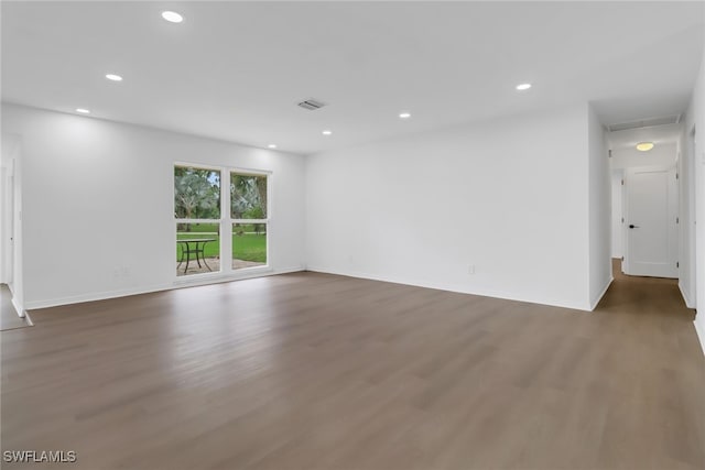 empty room featuring dark wood-type flooring