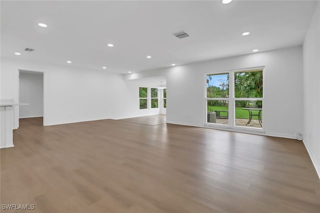 unfurnished room featuring hardwood / wood-style flooring