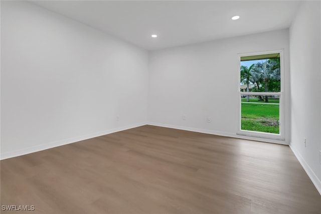 empty room with wood-type flooring