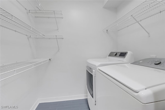 washroom featuring tile patterned flooring and independent washer and dryer