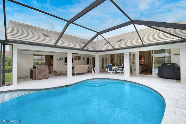 back of property featuring an outdoor living space, a lanai, and a patio area