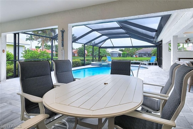 view of patio featuring a pool with hot tub and a lanai