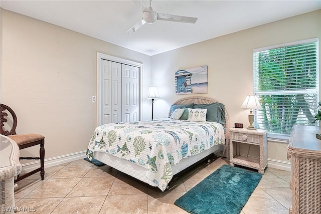 tiled bedroom with multiple windows, a closet, and ceiling fan