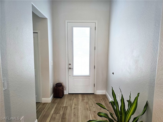 doorway to outside featuring light hardwood / wood-style floors