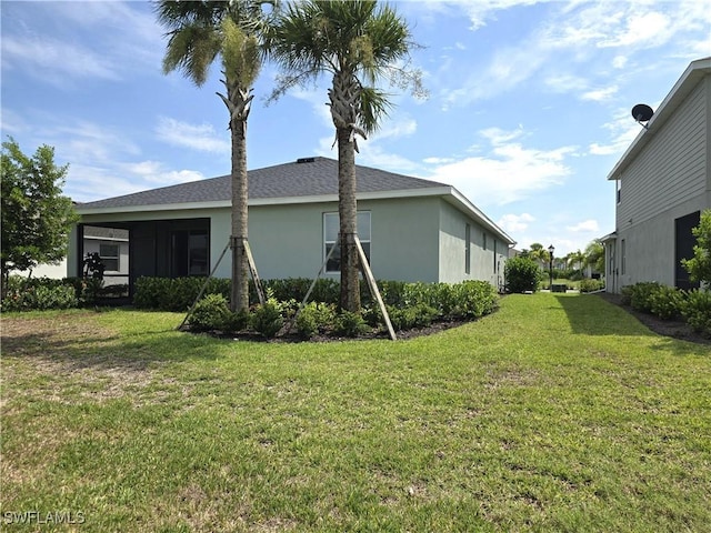 view of property exterior with a yard