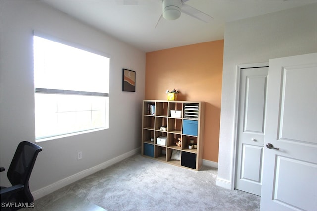 office area featuring ceiling fan and light colored carpet