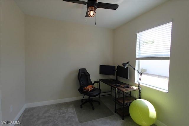 office area with ceiling fan and carpet