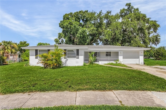 single story home with a front yard and a garage