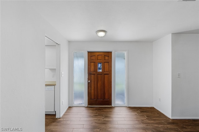 entryway with dark wood-type flooring