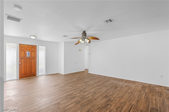 unfurnished room featuring ceiling fan and hardwood / wood-style flooring