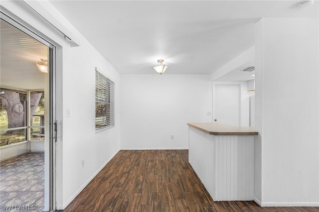 corridor with dark wood-type flooring