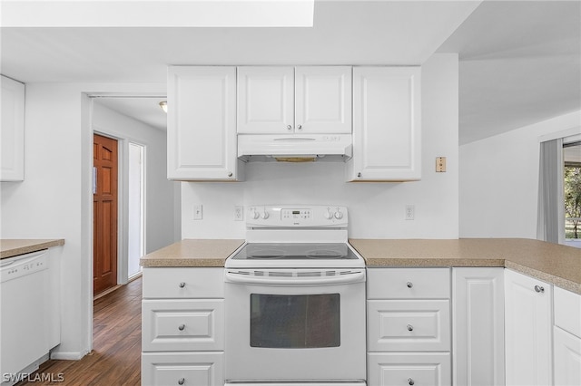 kitchen with white cabinets, dark hardwood / wood-style floors, and white appliances