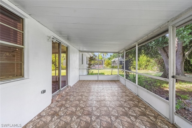 unfurnished sunroom with plenty of natural light