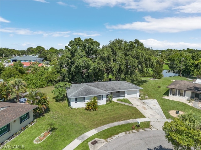 birds eye view of property with a water view