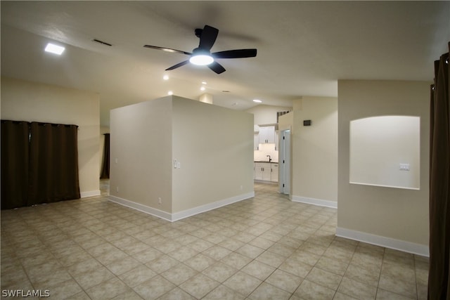 unfurnished room with light tile patterned floors and ceiling fan